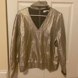 Sparkly gold V neck long sleeve, choker styled around the neck